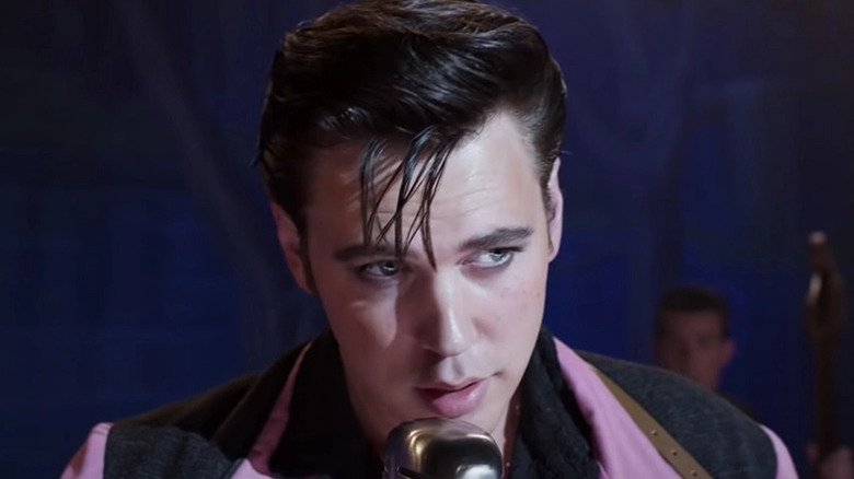 Austin Butler as Elvis at microphone