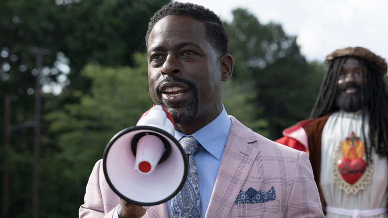 Sterling K. Brown as Rev. Childs with megaphone in Honk for Jesus