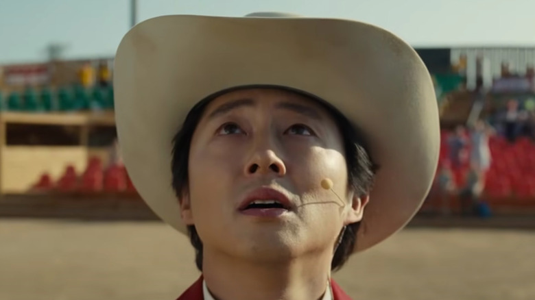 Steven Yuen in a cowboy hat in Nope