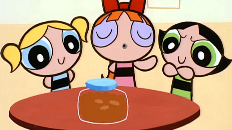 The Powerpuff Girls looking at a jar