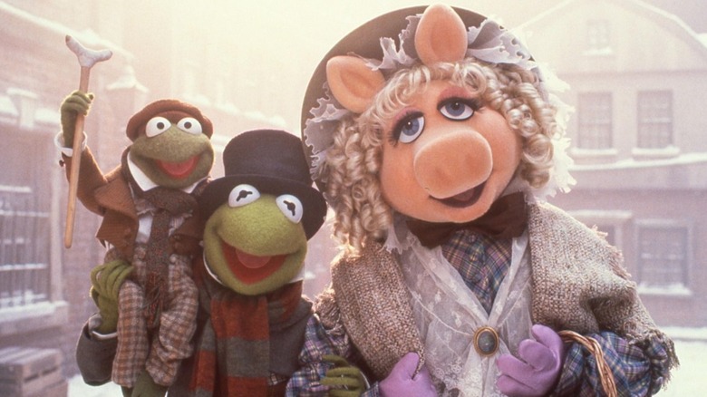 Robin, Kermit and Miss Piggy as the Cratchit family