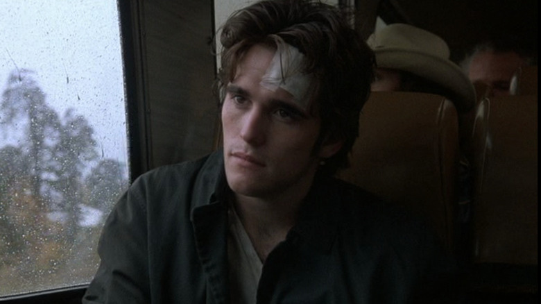 Matt Dillon bandaged forehead cocks head