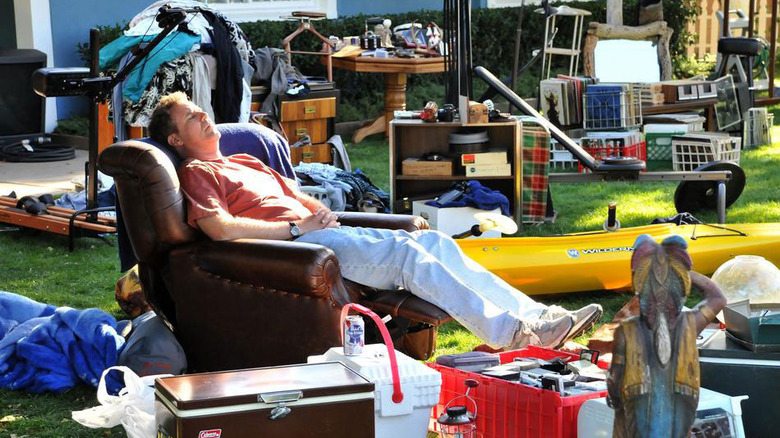 Will Ferrell sits in arm chair in yard sale