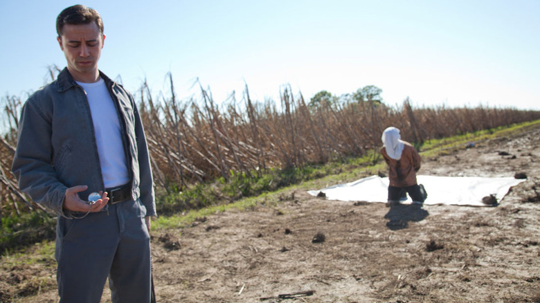 Joe and man in field