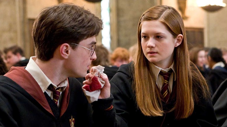 Ginny tending to Harry's bloody nose in the Great Hall