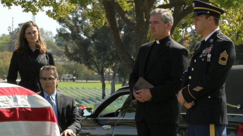 A veterans' funeral with Bones looking on