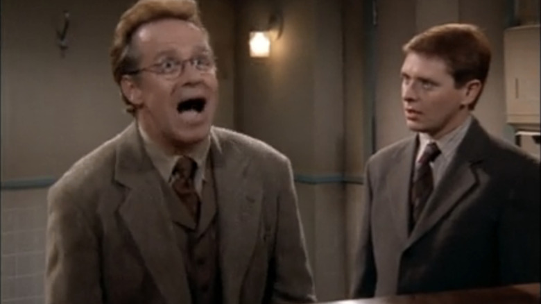 Phil Hartman plays piano in a bathroom with Dave Foley on "NewsRadio"