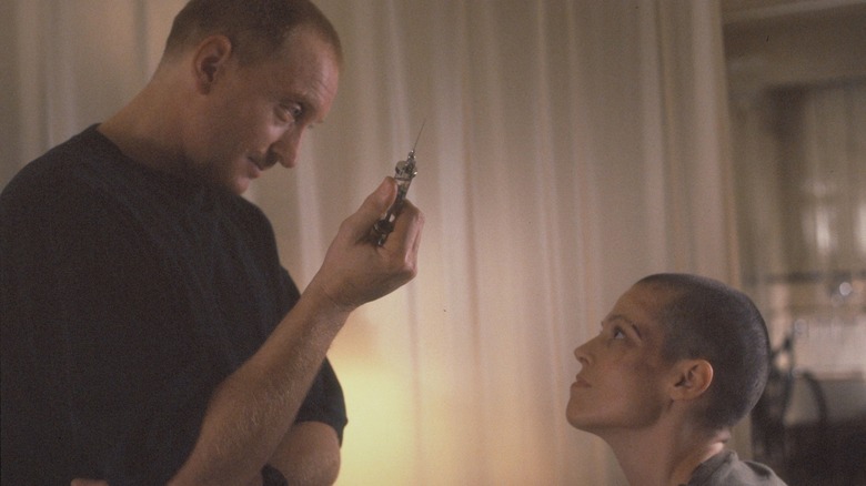 Clemens holding syringe in front of Ripley 