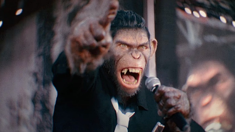 Robbie Williams in monkey form performs for a crowd in "Better Man" (2025)