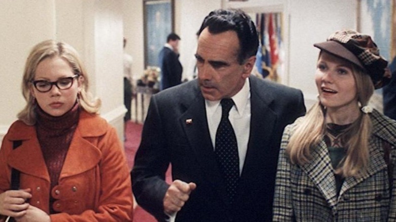 Nixon walks with Betsy and Arlene