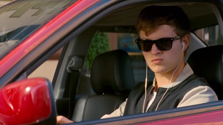 Baby sitting in his car in "Baby Driver" (2017)