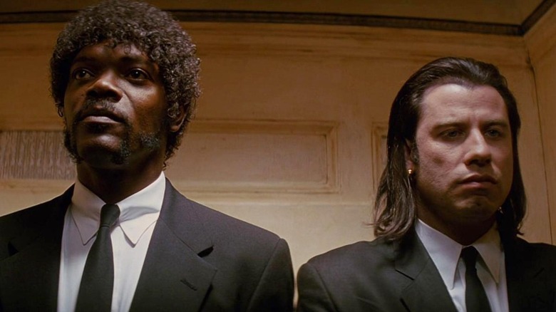 Vincent and Jules standing together in "Pulp Fiction" (1994)