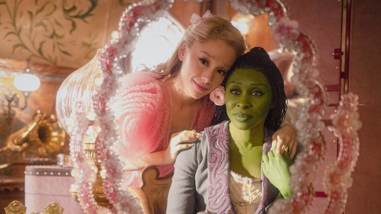 Glinda makes over Elphaba in the mirror in "Wicked" (2024)