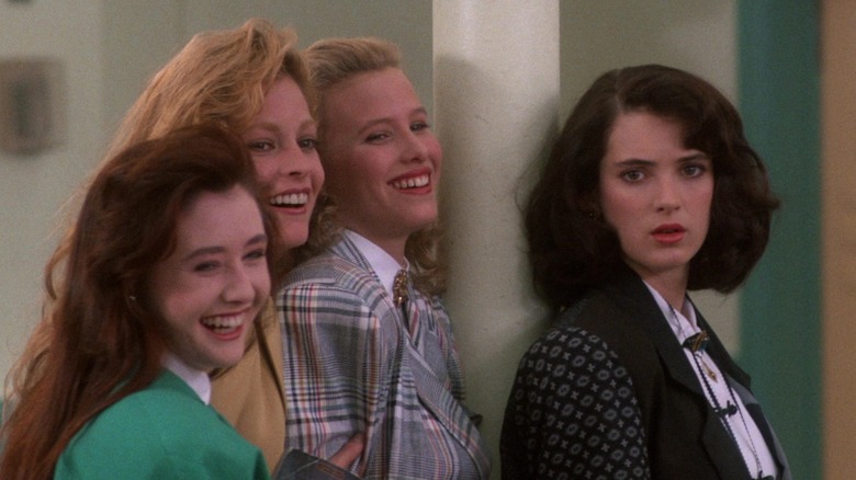 The Heathers smile while Veronica stares