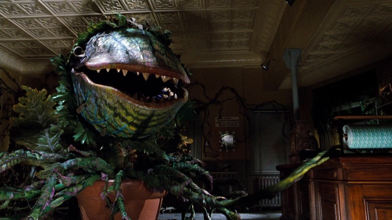 Audrey II sings and stretches its vines in "Little Shop of Horrors" (1986)