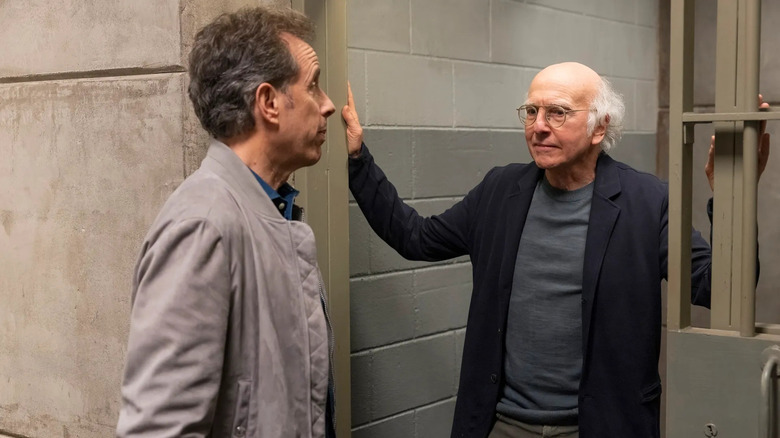 Jerry talks to Larry inside a jail cell in "Curb Your Enthusiasm"