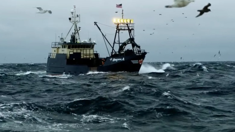 Fishing boat sailing the Bering Sea while seagulls fly by on Deadliest Catch