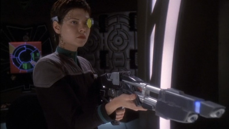 Ezri Dax holds a TR-116 rifle