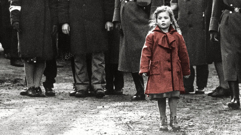 Little girl wearing a red coat in Schindler's List