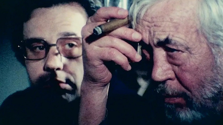 Peter Bogdanovich sitting with John Huston