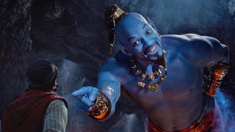 Genie pointing at Aladdin in live-action (2019)