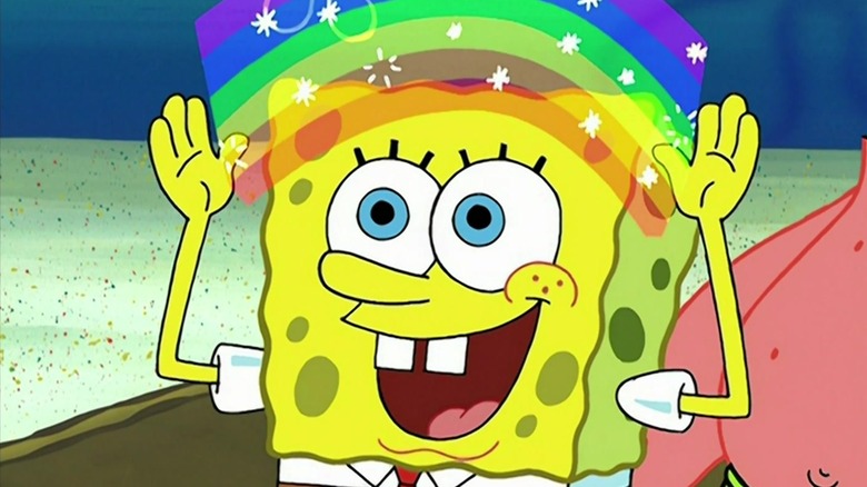 SpongeBob, inside a box, makes rainbows with his hands