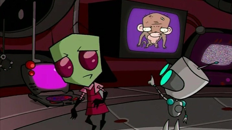 GIR points at a monkey on TV while ZIM stands by a laptop