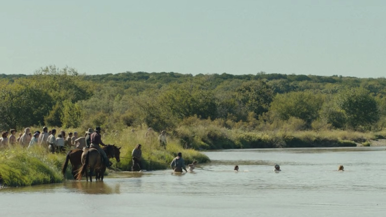 Group attempting to cross river in "1883"