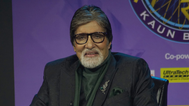 Amitabh Bachchan smiling with glasses