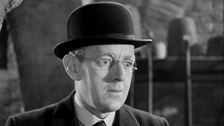 Alec Guinness wearing a hat