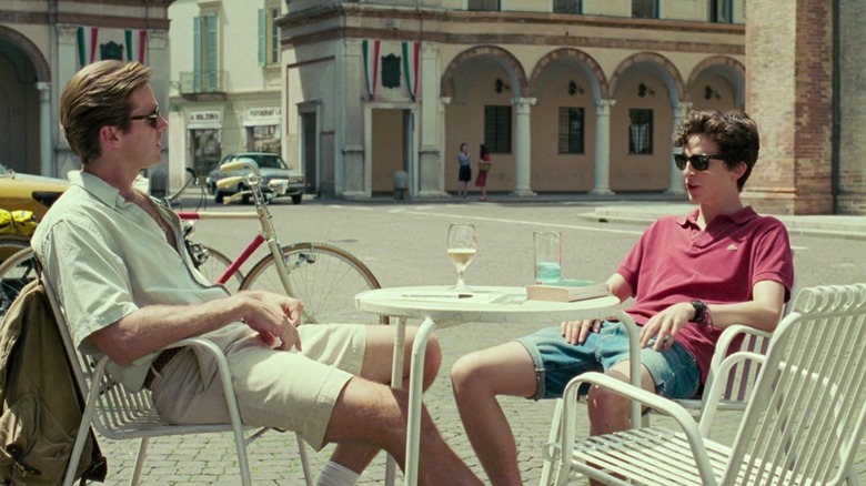 Armie Hammer and Timothee Chalamet sitting outside