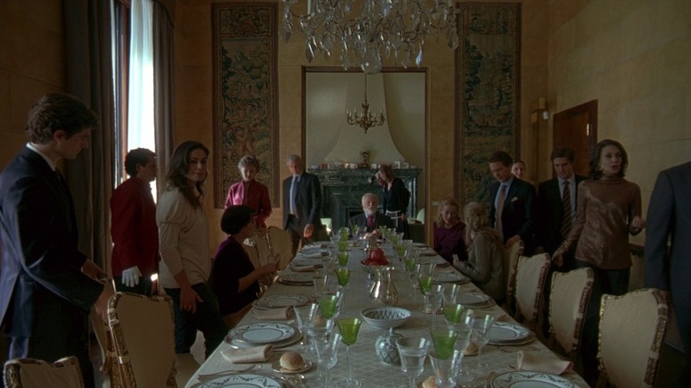 Family gather at a long table