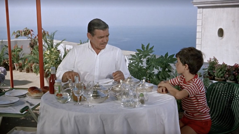 Man and boy enjoy food in Capri