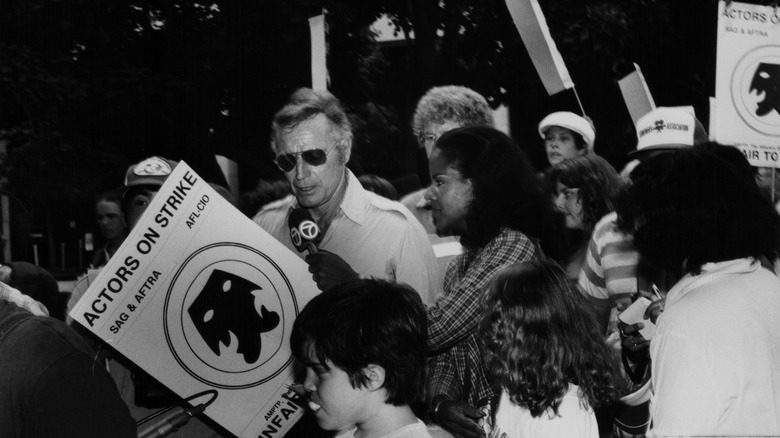 Charlton Heston talking to press