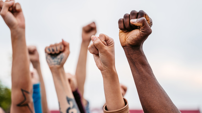 Fists raised in air