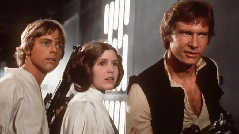 Luke, Leia, and Han Solo in a corridor