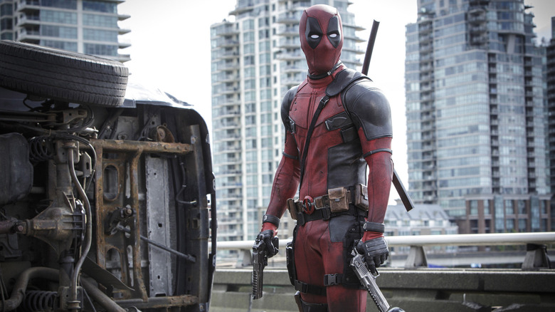 Deadpool stands on an overpass