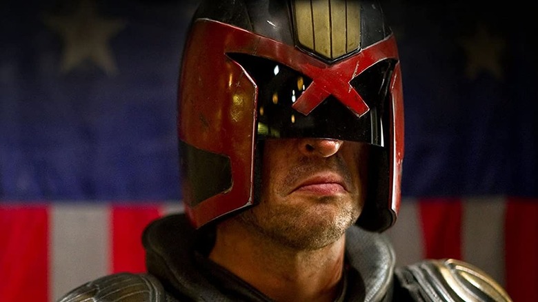 Dredd in front of flag