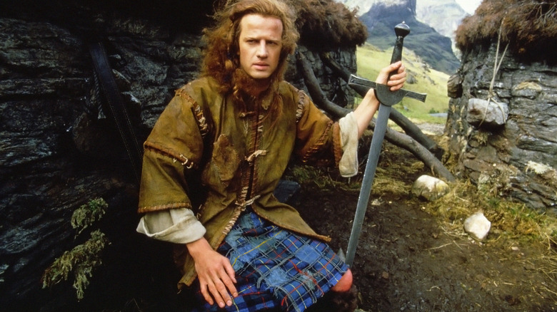 Connor MacLeod kneels with sword in ground