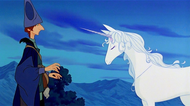 The unicorn and Schmendrick look at each other