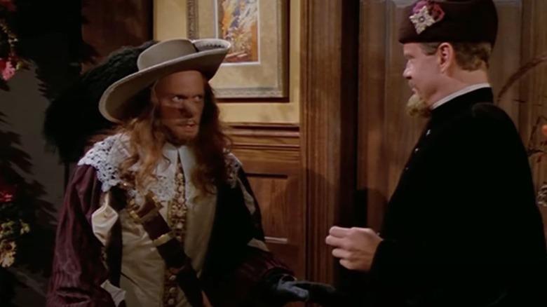 Niles dressed as Cyrano de Bergerac talking to Frasier