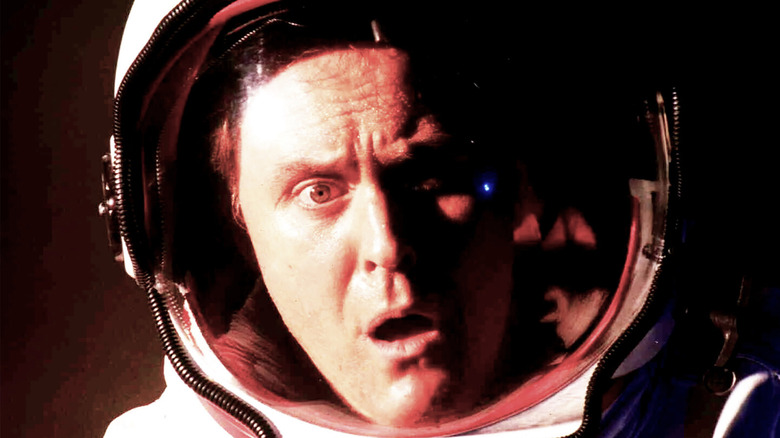 Lithgow shocked in a space helmet