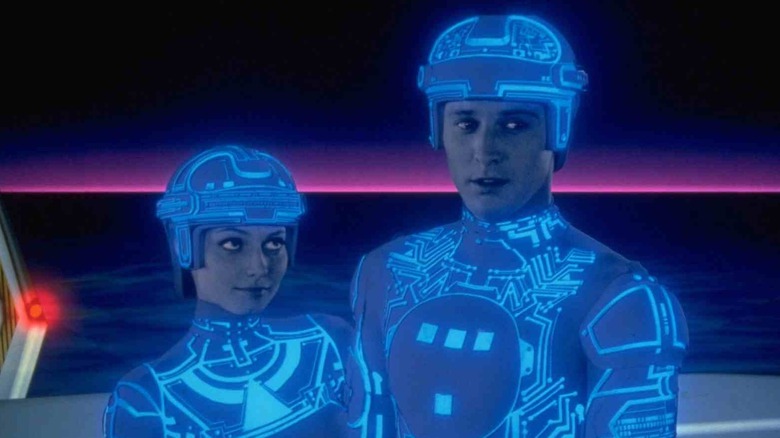 Woman looks at Tron in suit