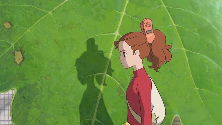 Arrietty stands next to a leaf