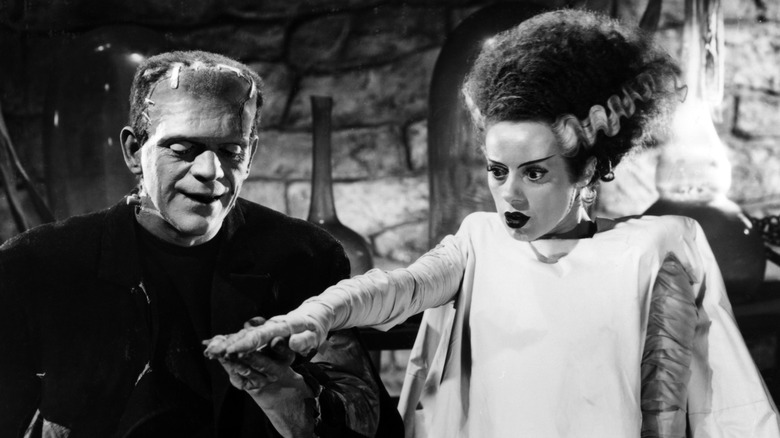 Frankenstein's Monster holding Bride's hand