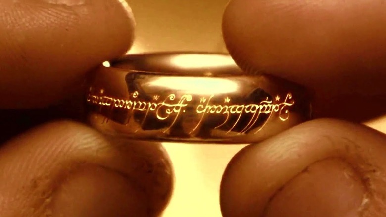 Fingers hold One Ring