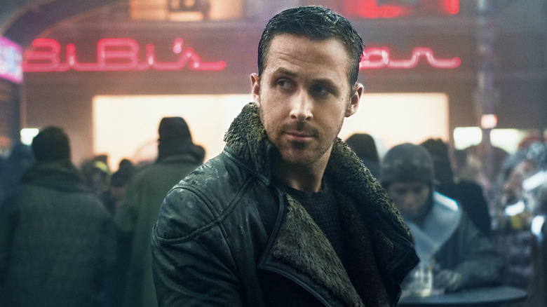 Gosling Deckard standing in market