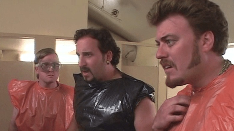 Bubbles, Julian, Ricky, wearing garbage-suits