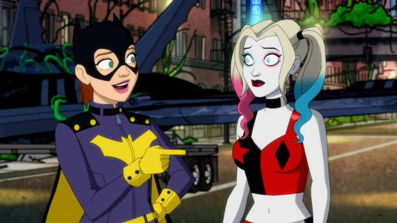 Batgirl pointing at Harley Quinn