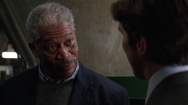 Morgan Freeman smiling at Christian Bale